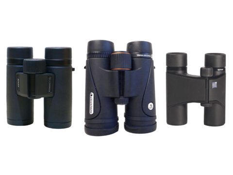 three binoculars of three different sizes arranged against a white background